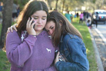 Students react following a shooting at Marjory Stoneman Douglas High School in Parkland, Florida, a city about 50 miles (80 kilometers) north of Miami on February 14, 2018. (Michele Eve Sandberg/AFP/Getty)