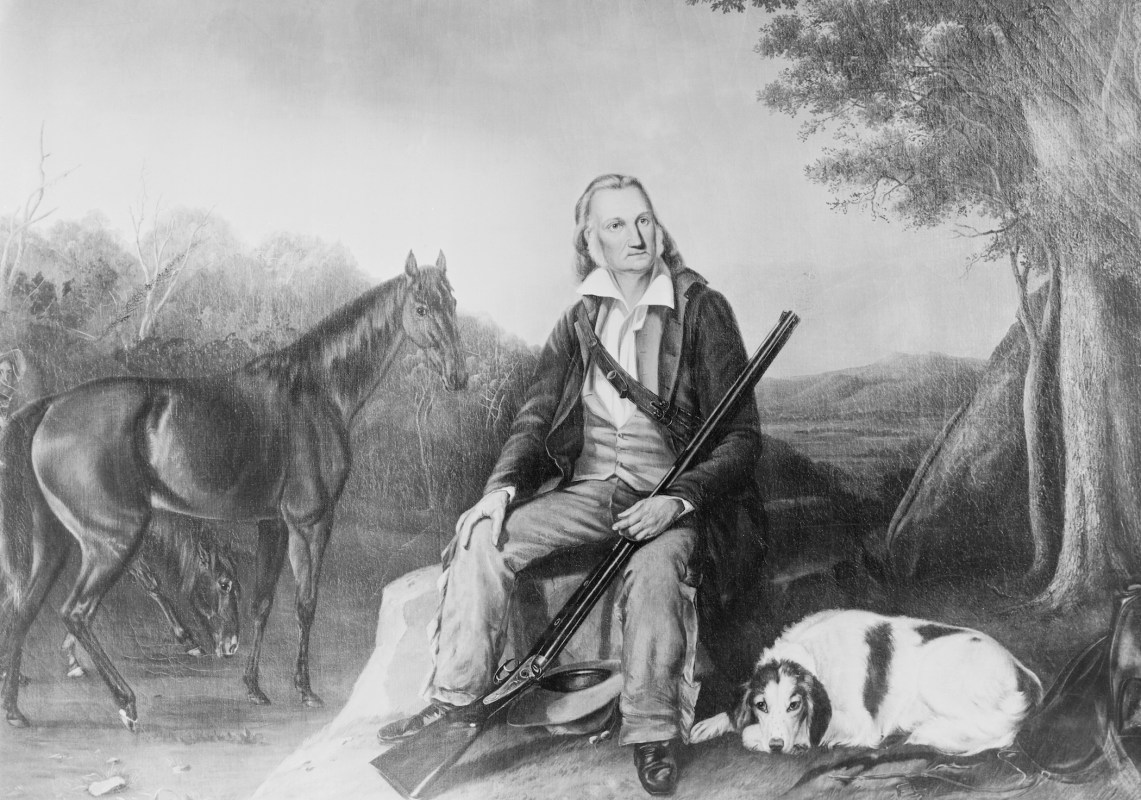 American naturalist. Painting by unknown artist showing Audubon in landscape holding his rifle with his hunting dog and horse by his side. Undated painting.