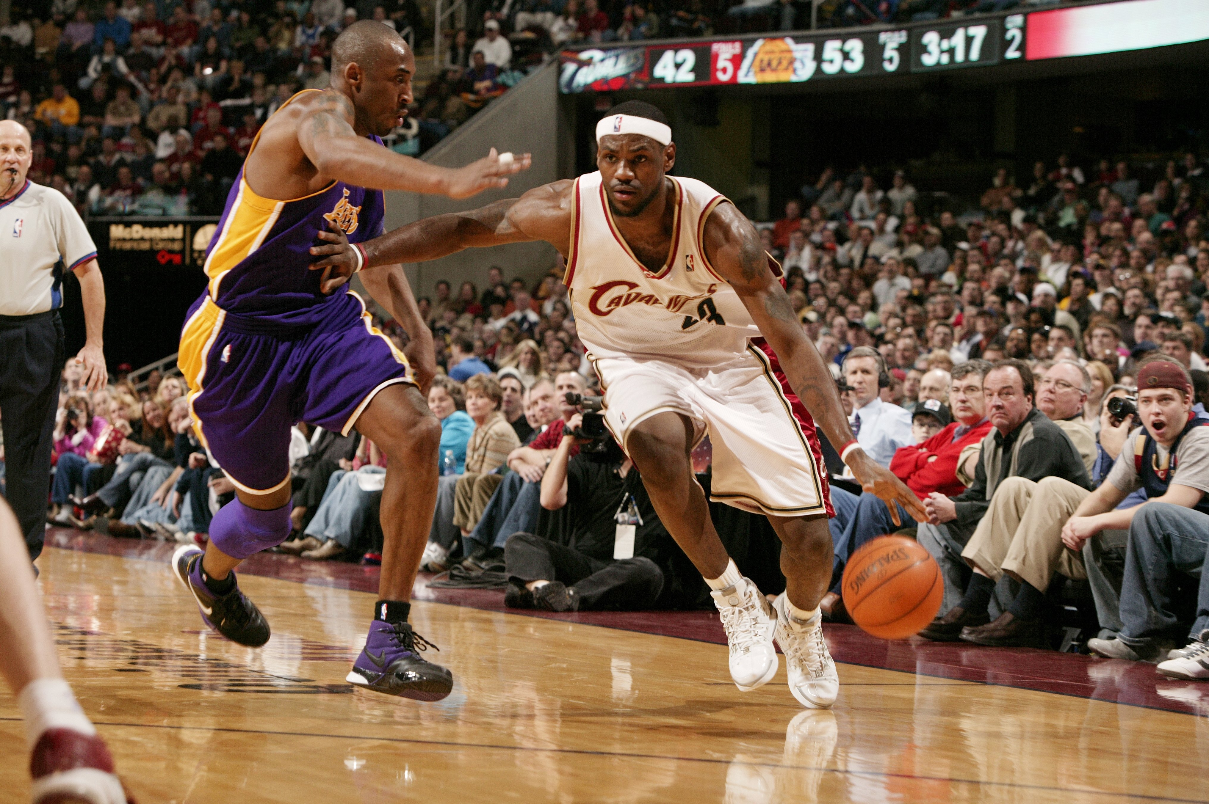 LeBron James #23 of the Cleveland Cavaliers drives to the basket against Kobe Bryant #8 of the Los Angeles Lakers on March 19, 2006 at the Quicken Loans Arena in Cleveland, Ohio.  (Garrett W. Ellwood/NBAE via Getty Images)