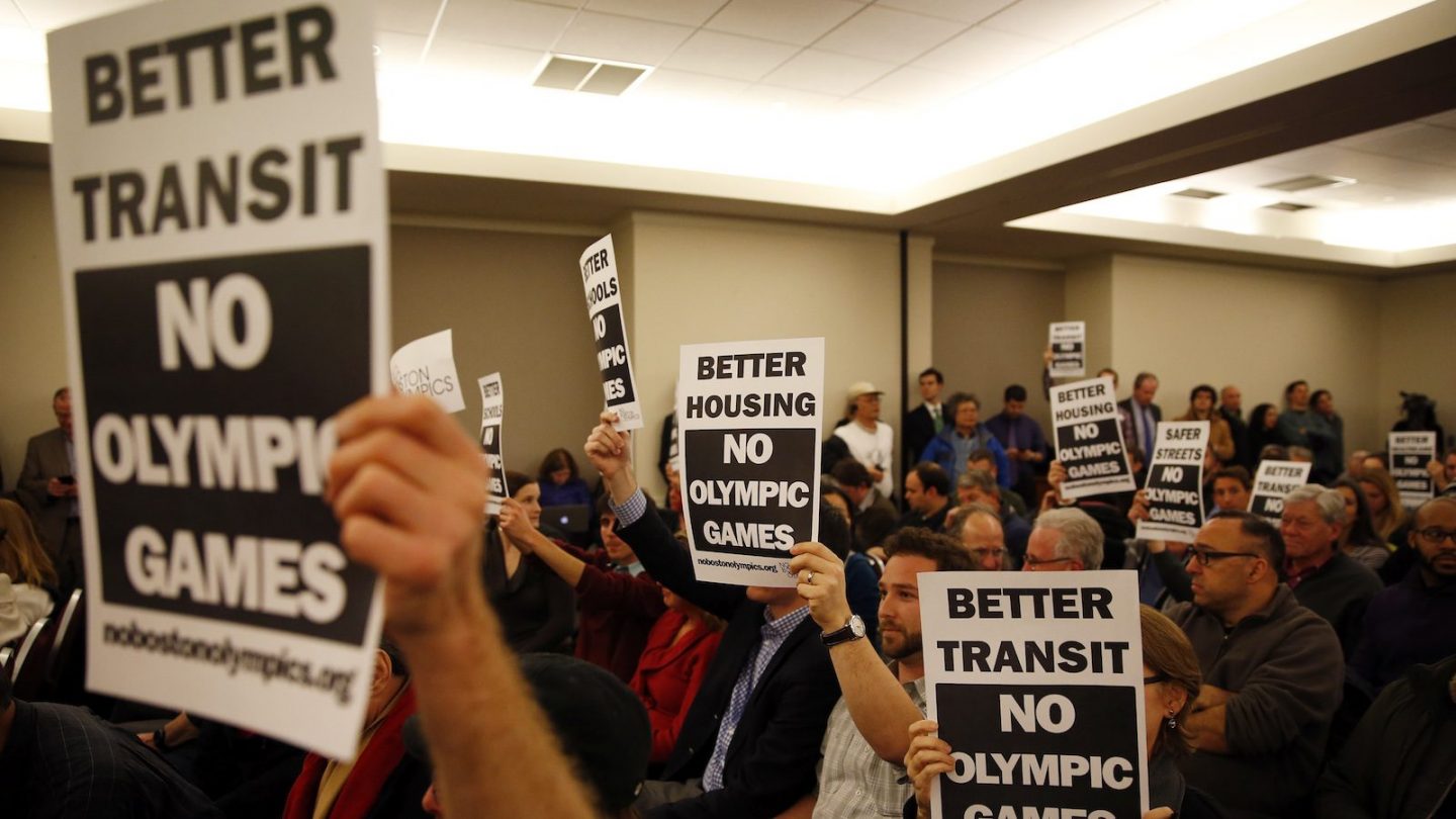 Signs protesting the Olympics being held in Boston during a Community Meeting at Suffolk Law School in Boston, Massachusetts February 5, 2015. (Jessica Rinaldi/The Boston Globe via Getty Images)