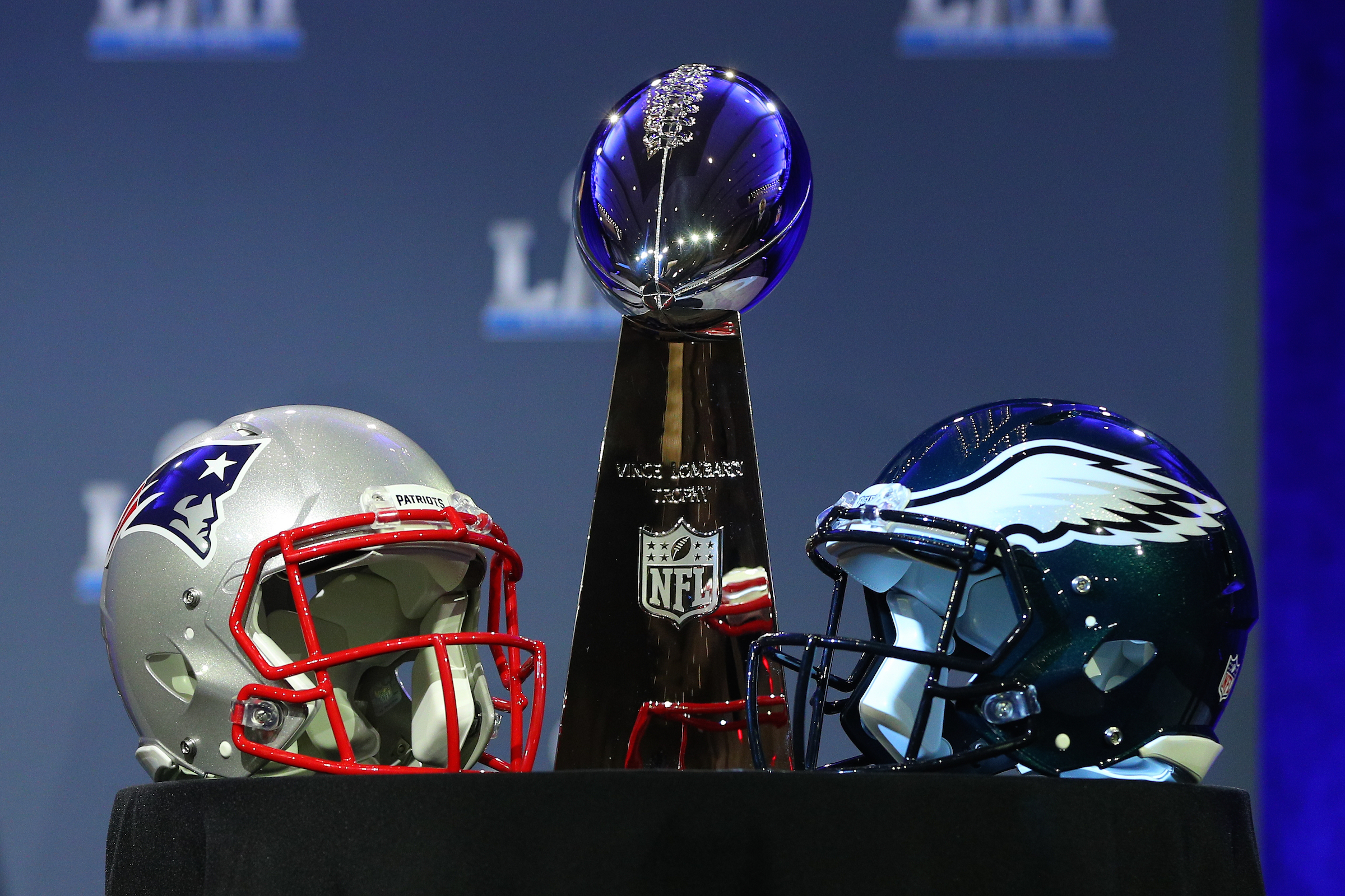 The Vince Lombardi Trophy and the New England Patriots helmet and the Philadelphia Eagles helmet on display at the Commissioners Press Conference on January 31, 2018, at the Hilton Minneapolis Grand Ballroom, in Minneapolis, MN.  (Photo by Rich Graessle/Icon Sportswire via Getty Images)