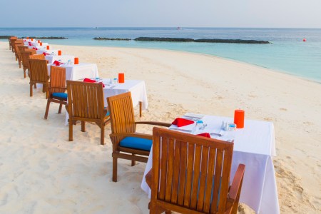 Laid Tables for a Romantic Dinner at the White Sandy Beach of Coco Bodu Hiti, North-Male-Atoll on February 24, 2017 in Male, Maldives. (Photo by EyesWideOpen/Getty Images)