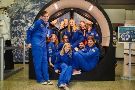 A Space Camp team poses for its graduation photo in a view portal mockup from the International Space Station. (John Scott Lewinski)