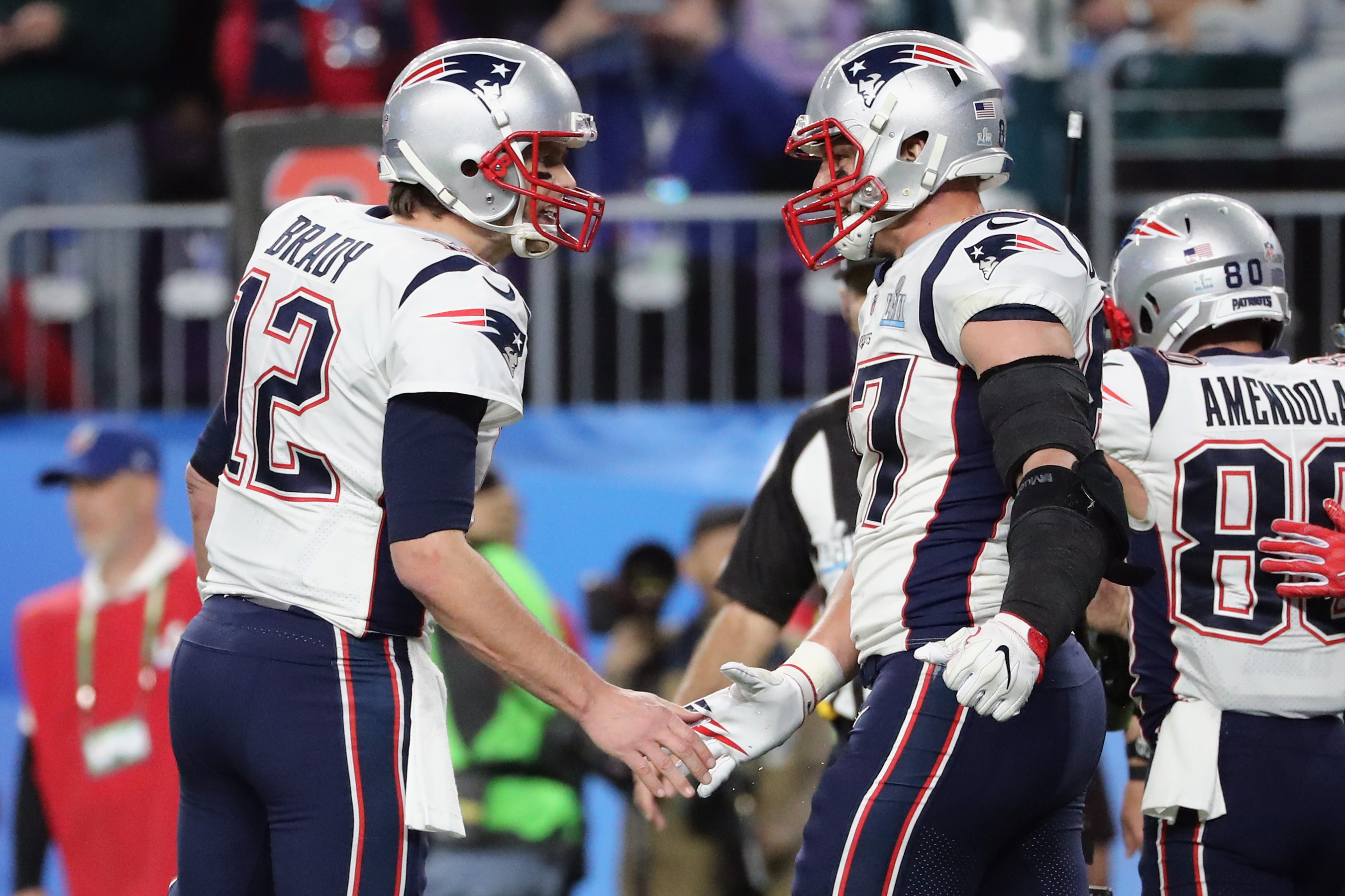 Tom Brady #12 and Rob Gronkowski #87 of the New England Patriots celebrate a 5-yard touchdown against the Philadelphia Eagles in the third quarter of Super Bowl LII at U.S. Bank Stadium on February 4, 2018 in Minneapolis, Minnesota. (Photo by Elsa/Getty Images)