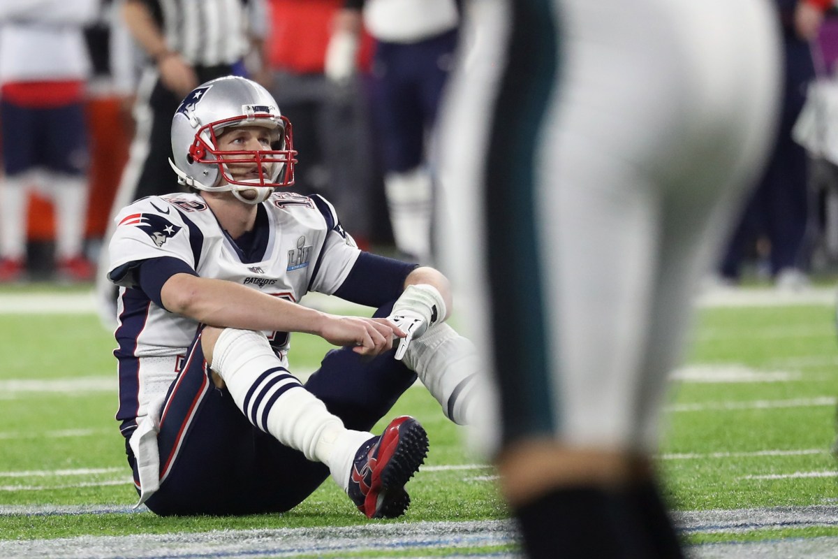 Tom Brady #12 of the New England Patriots reacts after fumbling the ball during the fourth quarter against the Philadelphia Eagles in Super Bowl LII at U.S. Bank Stadium on February 4, 2018 in Minneapolis, Minnesota. (Rob Carr/Getty Images)
