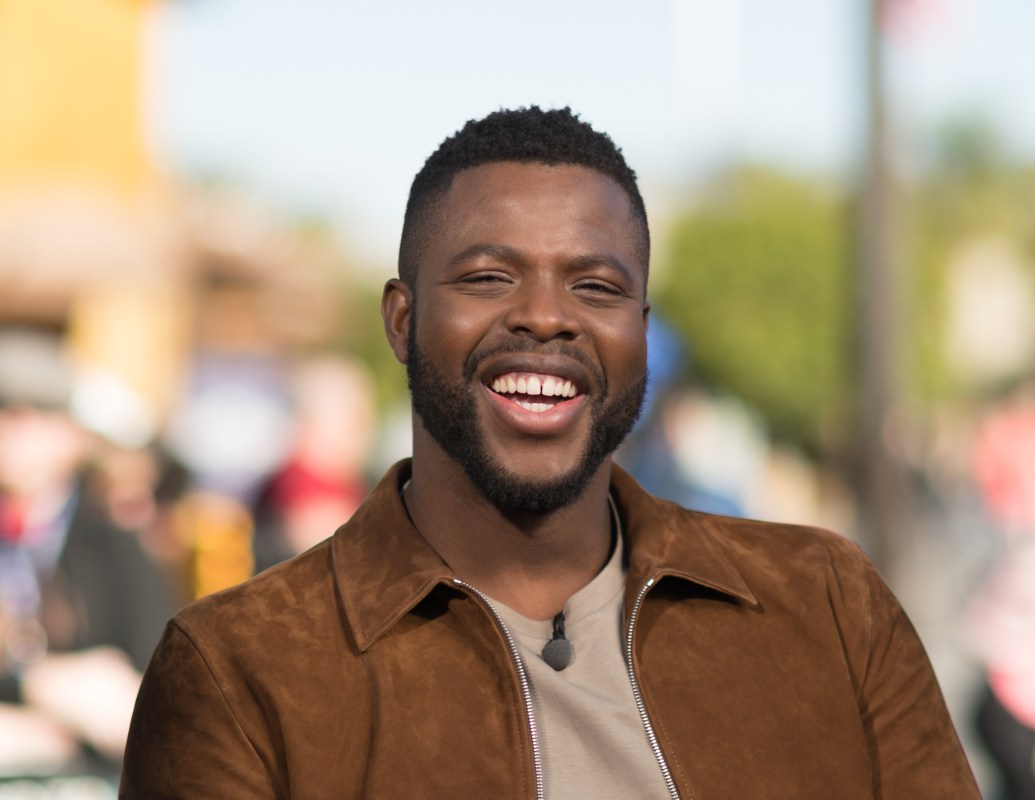 Winston Duke takes a selfie with fans at "Extra" at Universal Studios Hollywood on February 19, 2018 in Universal City, California.  (Photo by Noel Vasquez/Getty Images)