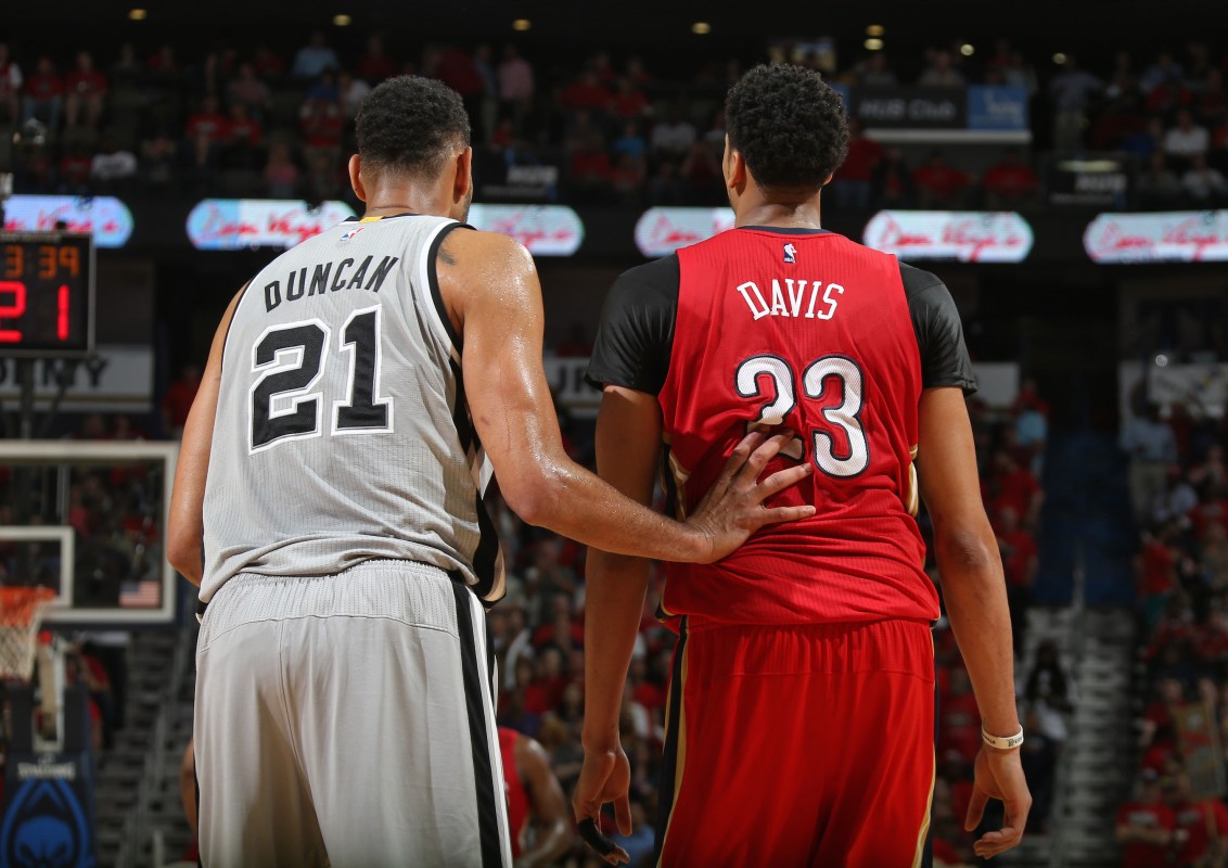 Tim Duncan #21 of the San Antonio Spurs and Anthony Davis #23 of the New Orleans Pelicans during the game on April 15, 2015 at Smoothie King Center in New Orleans, Louisiana. NOTE TO USER: User expressly acknowledges and agrees that, by downloading and or using this photograph, User is consenting to the terms and conditions of the Getty Images License Agreement. Mandatory Copyright Notice: Copyright 2015 NBAE (Photo by Layne Murdoch Jr,/NBAE via Getty Images)