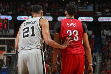 Tim Duncan #21 of the San Antonio Spurs and Anthony Davis #23 of the New Orleans Pelicans during the game on April 15, 2015 at Smoothie King Center in New Orleans, Louisiana. NOTE TO USER: User expressly acknowledges and agrees that, by downloading and or using this photograph, User is consenting to the terms and conditions of the Getty Images License Agreement. Mandatory Copyright Notice: Copyright 2015 NBAE (Photo by Layne Murdoch Jr,/NBAE via Getty Images)