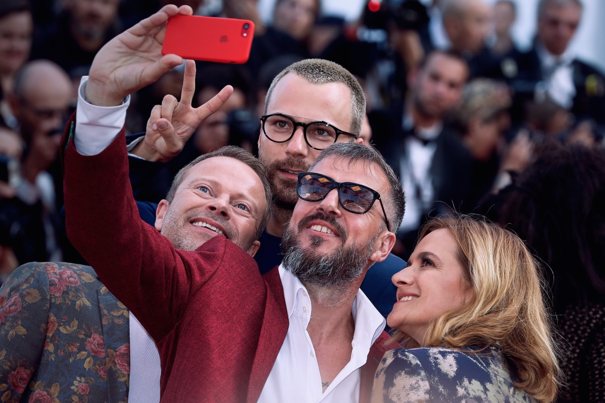 Guests take a selfie at the red carpet before the 'The Beguiled' screening during the 70th annual Cannes Film Festival at Palais des Festivals on May 24, 2017 in Cannes, France. (Photo by Oleg Nikishin/Epsilon/Getty Images)