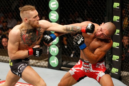 Conor McGregor lands a left to the head of Diego Brandao in their featherweight bout during the UFC Fight Night event at The O2 Dublin on July 19, 2014 in Dublin, Ireland.  (Josh Hedges/Zuffa LLC/Zuffa LLC via Getty Images)