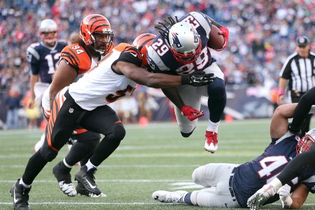 LeGarrette Blount #29 of the New England Patriots gains yards as Vontaze Burfict #55 of the Cincinnati Bengals defends in the fourth quarter at Gillette Stadium. (Photo by Jim Rogash/Getty Images)