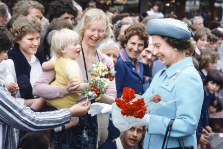 Royal Tour of Australasia by Queen Elizabeth II and Prince Philip, Duke of Edinburgh. They flew out from London to New Zealand where they stayed from the 12th to the 20th October 1981 before gong on to Australia for one day and ending in Sri Lanka from 21st to 25th October. Here Queen Elizabeth II greets enthusiastic crowd members who have gathered to see her. October 1981. (Photo by Mike Maloney/Mirrorpix/Getty Images)