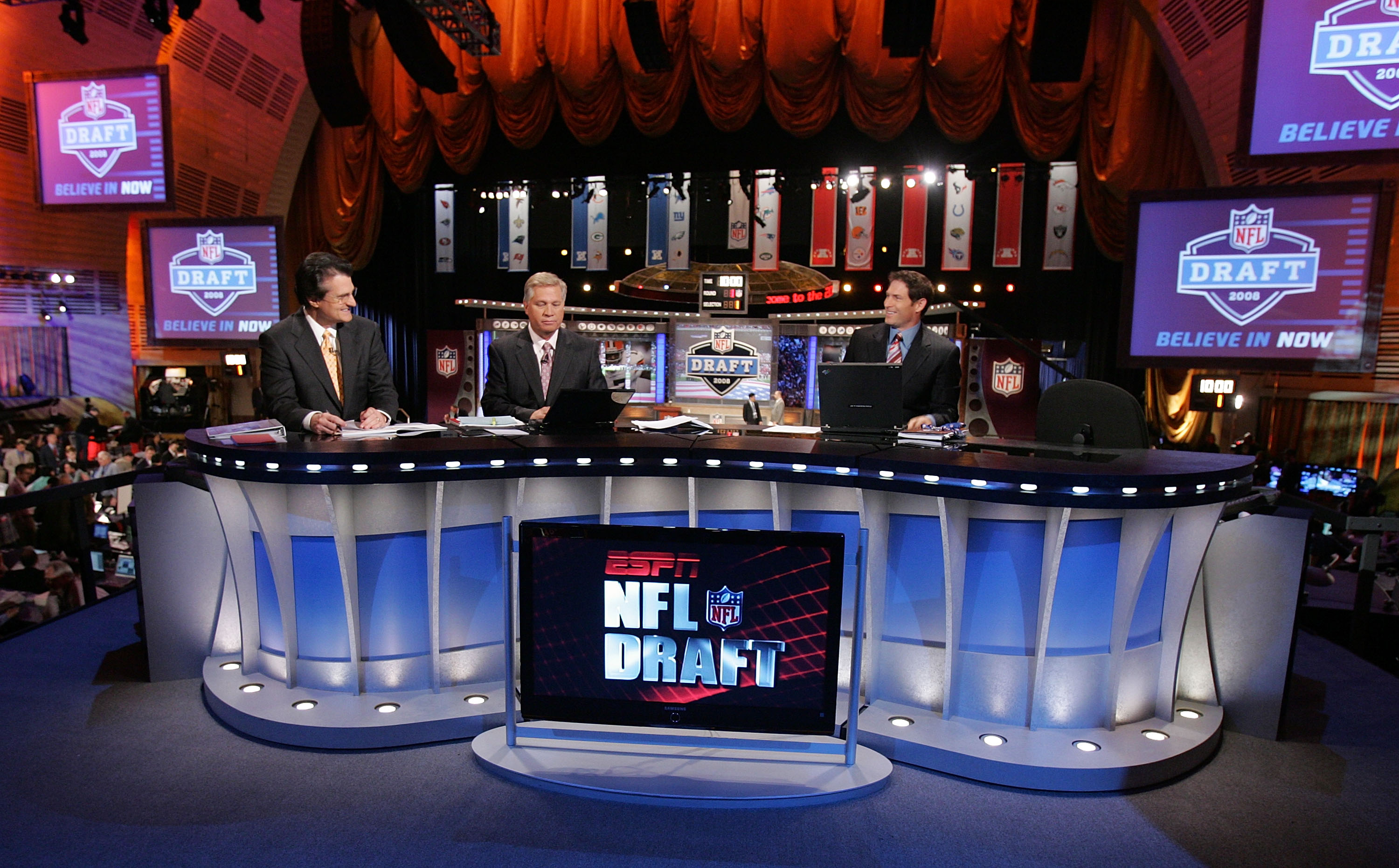 The ESPN broadcast team of (L-R) Mel Kiper, Chris Mortensen, and Steve Young prepare for the 2008 NFL Draft on April 26, 2008 at Radio City Music Hall in New York, New York. (Photo by Jim McIsaac/Getty Images)
