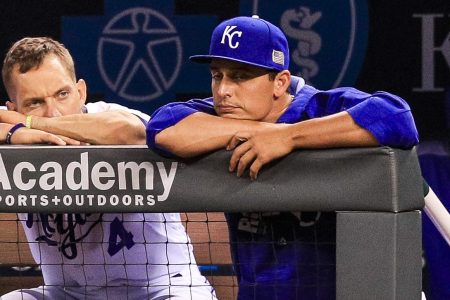 Alex Gordon #4 and Jason Vargas #51 of the Kansas City Royals sit in dejection in the dugout during ninth inning against the Chicago White Sox at Kauffman Stadium. (Photo by Brian Davidson/Getty Images)