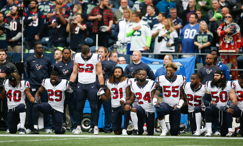 Members of the Houston Texans stand and kneel before the game against the Seattle Seahawks at CenturyLink Field on October 29, 2017 in Seattle, Washington. . (Photo by Otto Greule Jr/Getty Images)