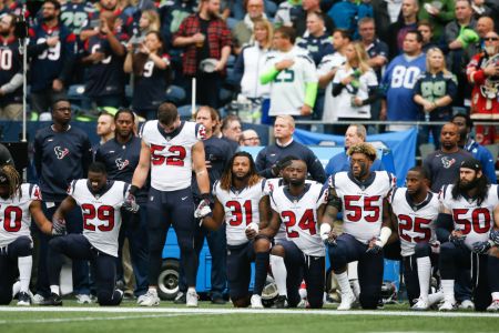 Members of the Houston Texans stand and kneel before the game against the Seattle Seahawks at CenturyLink Field on October 29, 2017 in Seattle, Washington. . (Photo by Otto Greule Jr/Getty Images)