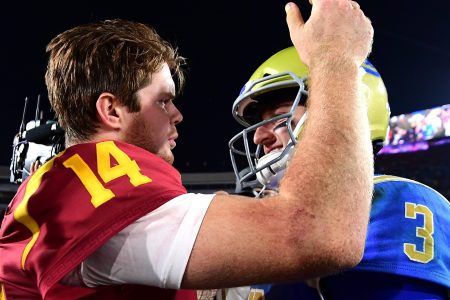 Josh Rosen #3 of the UCLA Bruins and Sam Darnold #14 of the USC Trojans meet on the field after a 28-23 Trojan win at Los Angeles Memorial Coliseum on November 18, 2017 in Los Angeles, California.  (Photo by Harry How/Getty Images)