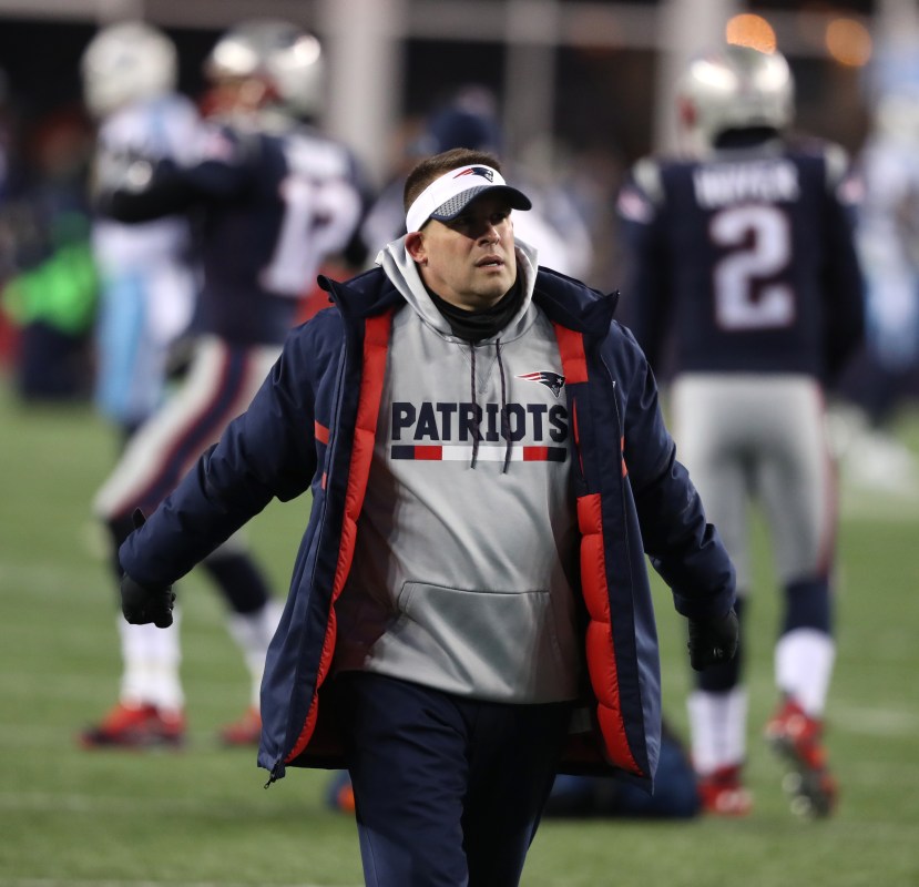 New England Patriots offensive coordinator Josh McDaniels walks on the field before the game. The New England Patriots host the Tennessee Titans in an NFL AFC Divisional Playoff game at Gillette Stadium. (Photo by Jim Davis/The Boston Globe via Getty Images)