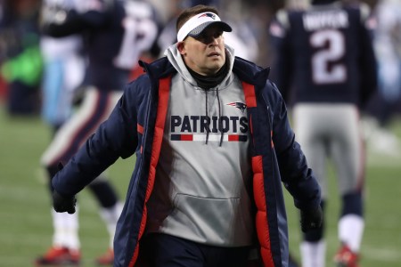 New England Patriots offensive coordinator Josh McDaniels walks on the field before the game. The New England Patriots host the Tennessee Titans in an NFL AFC Divisional Playoff game at Gillette Stadium. (Photo by Jim Davis/The Boston Globe via Getty Images)
