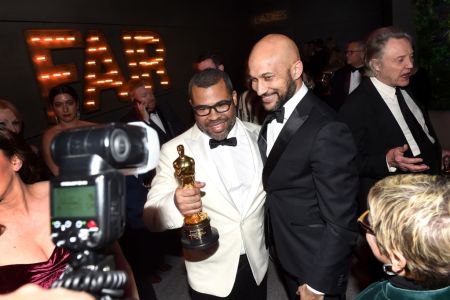 Jordan Peele and Keegan-Michael Key attend the 2018 Vanity Fair Oscar Party hosted by Radhika Jones at Wallis Annenberg Center for the Performing Arts on March 4, 2018 in Beverly Hills, California.