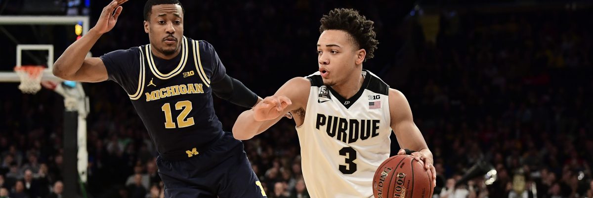 Carsen Edwards #3 of the Purdue Boilermakers drives against Muhammad-Ali Abdur-Rahkman #12 of the Michigan Wolverines during the championship game of the Big Ten Basketball Tournament.
 (Photo by Steven Ryan/Getty Images)