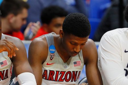 Emmanuel Akot #24 of the Arizona Wildcats (L) and Dylan Smith #3 (C) react in the second half against the Buffalo Bulls during the first round of the 2018 NCAA Men's Basketball Tournament. (Photo by Kevin C. Cox/Getty Images)