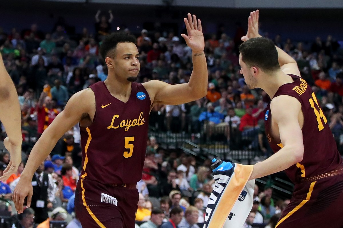 Marques Townes #5 and Ben Richardson #14 of the Loyola Ramblers celebrate in the second half against the Tennessee Volunteers during the second round of the 2018 NCAA Tournament at the American Airlines Center on March 17, 2018 in Dallas, Texas. (Photo by Tom Pennington/Getty Images)