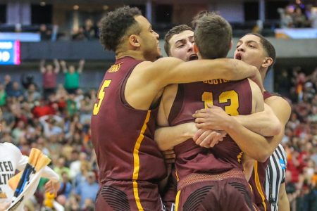Loyola-Chicago Ramblers players celebrate winning the NCAA Div I Men's Championship Second Round basketball game between Loyola-Chicago and Tennessee on March 17. (Photo by George Walker/Icon Sportswire via Getty Images)