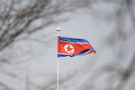The North Korean flag flies above the North Korean embassy in Beijing on March 9, 2018.
US President Donald Trump agreed to a historic first meeting with North Korean leader Kim Jong Un in a stunning development in America's high-stakes nuclear standoff with North Korea. / AFP PHOTO / GREG BAKER        (Photo credit should read GREG BAKER/AFP/Getty Images)