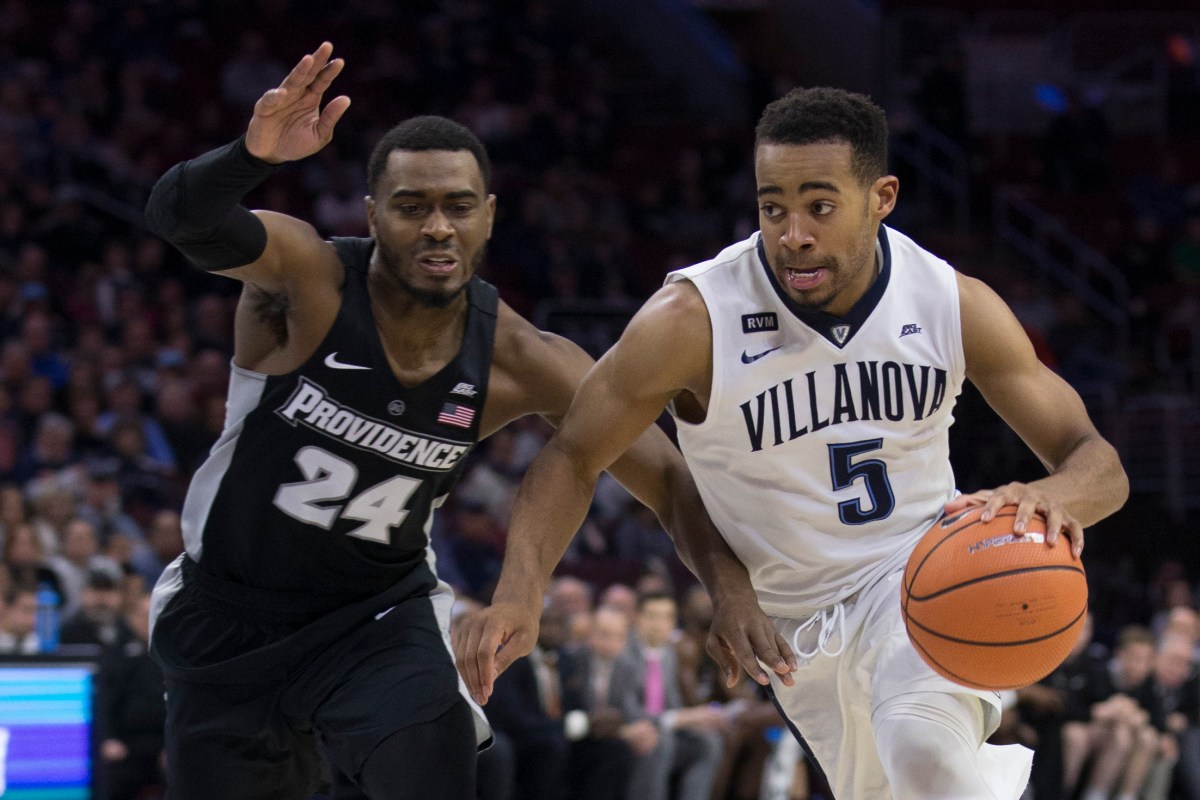 Phil Booth #5 of the Villanova Wildcats drives to the basket against Kyron Cartwright #24 of the Providence Friars in the second half at the Wells Fargo Center on January 23, 2018 in Philadelphia, Pennsylvania. The Wildcats defeated the Friars 89-69. (Photo by Mitchell Leff/Getty Images)