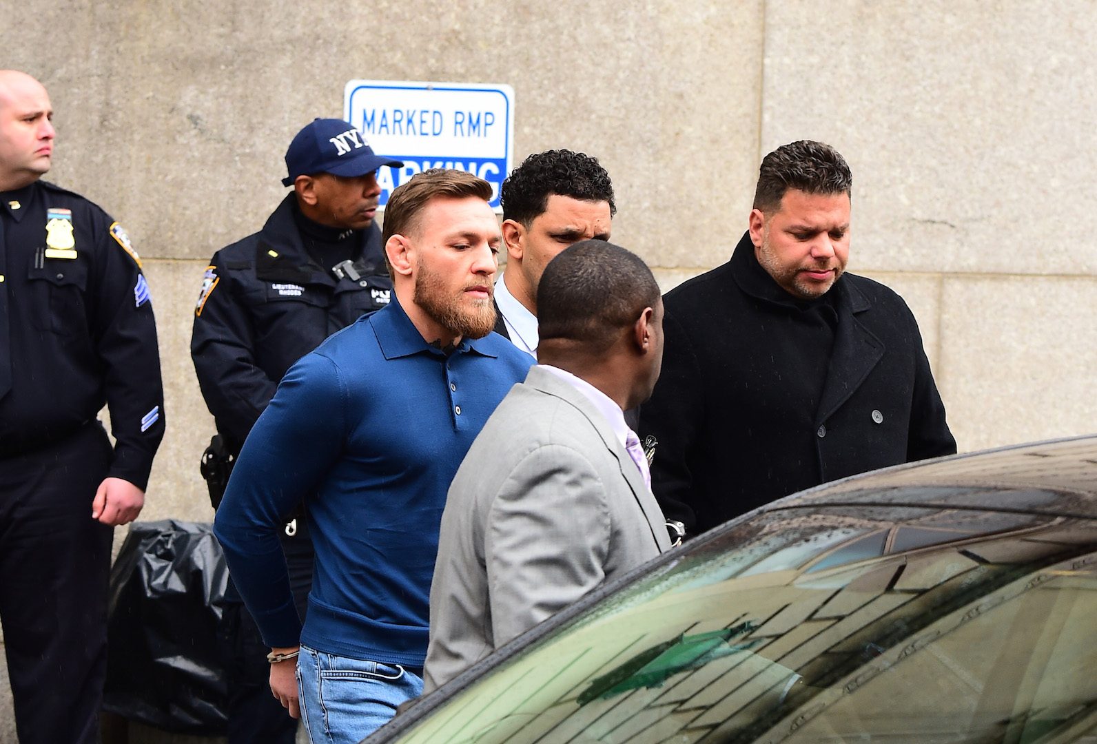 A handcuffed Conor McGregor is seen leaving the 78th Precinct in Brooklyn on April 6, 2018 in New York City, following his arrest for attacking a bus at UFC 223. (Raymond Hall/GC Images)