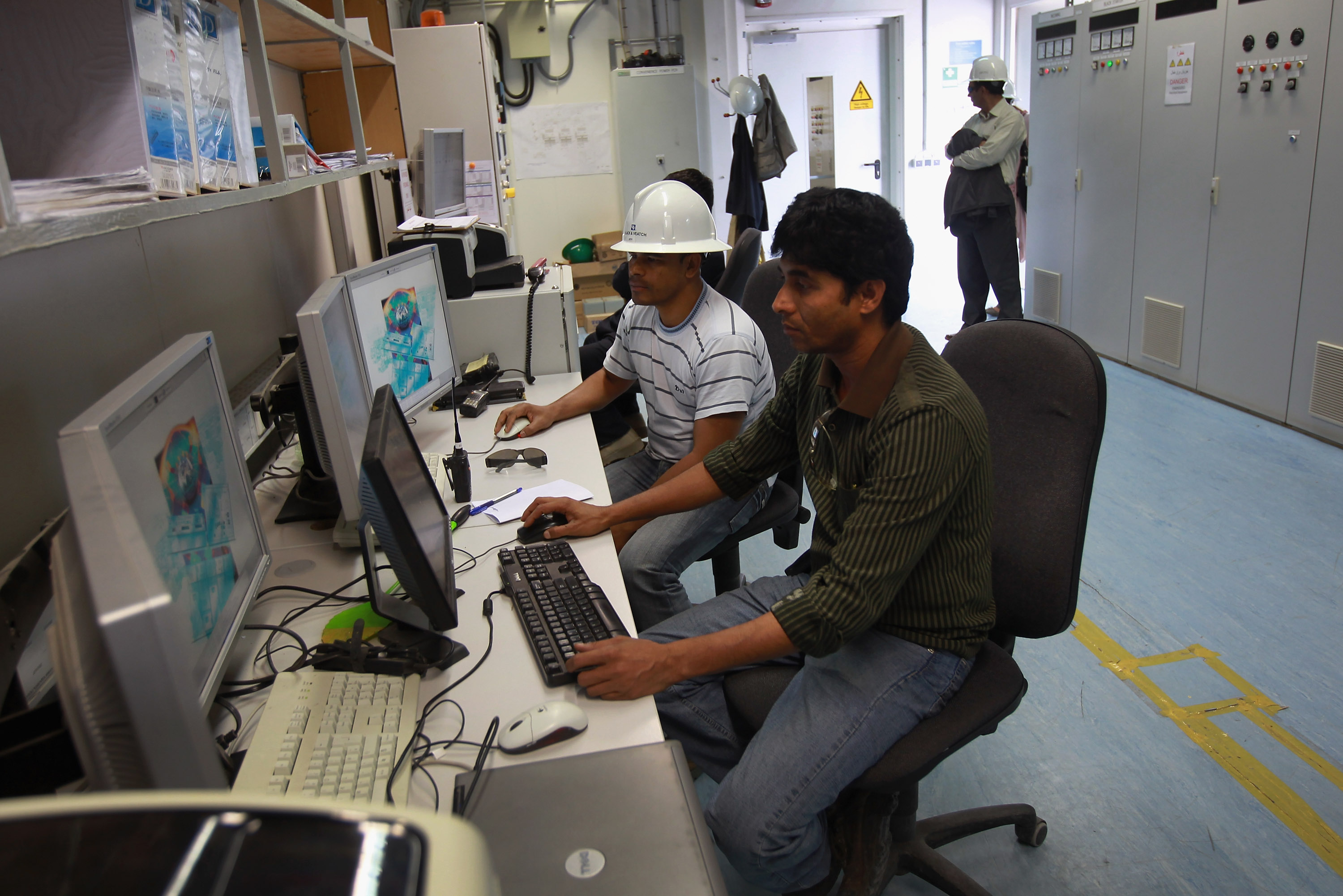 Engineers work in the control room of the U.S.-built 105MW Tarakhil Power Plant on September 8, 2011 in Tarakhil, Afghanistan, on the outskirts of Kabul. (John Moore/Getty Images)