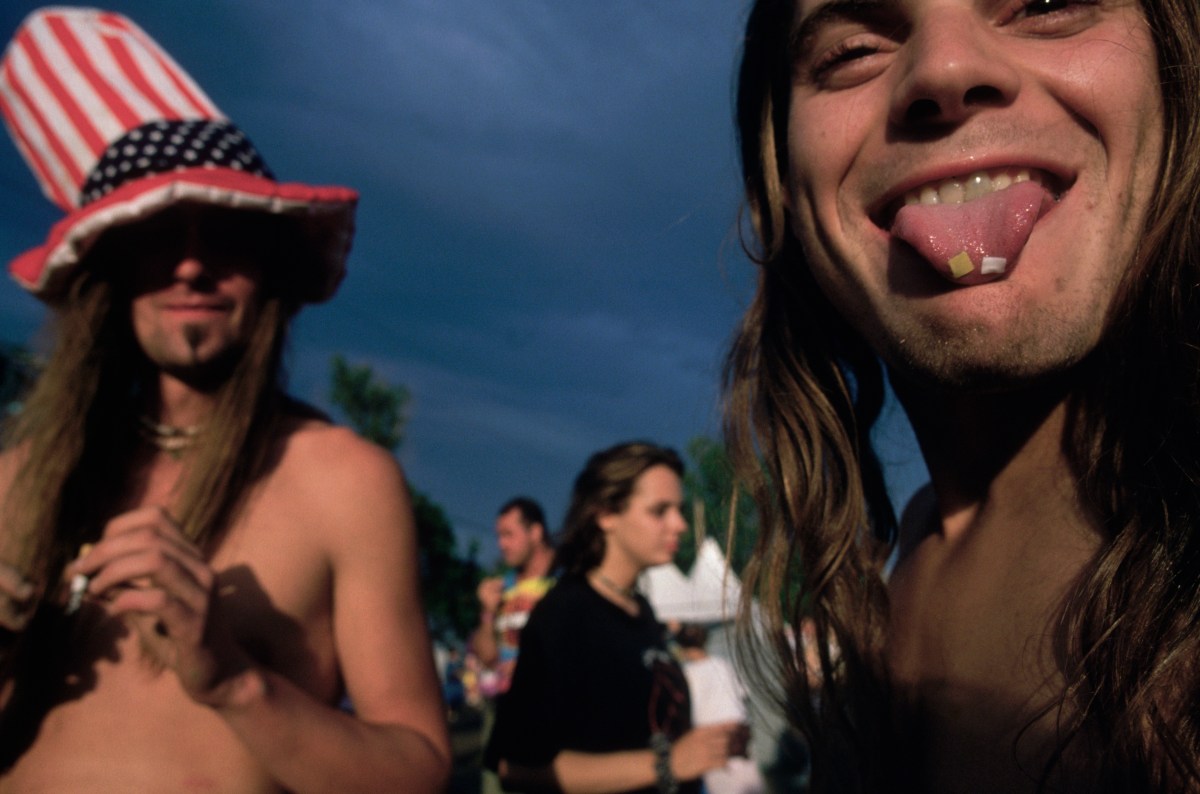 Saugerties, New York: Woodstock 94 - LSD tabs on tip of young man's tongue. (Photo by mark peterson/Corbis via Getty Images)