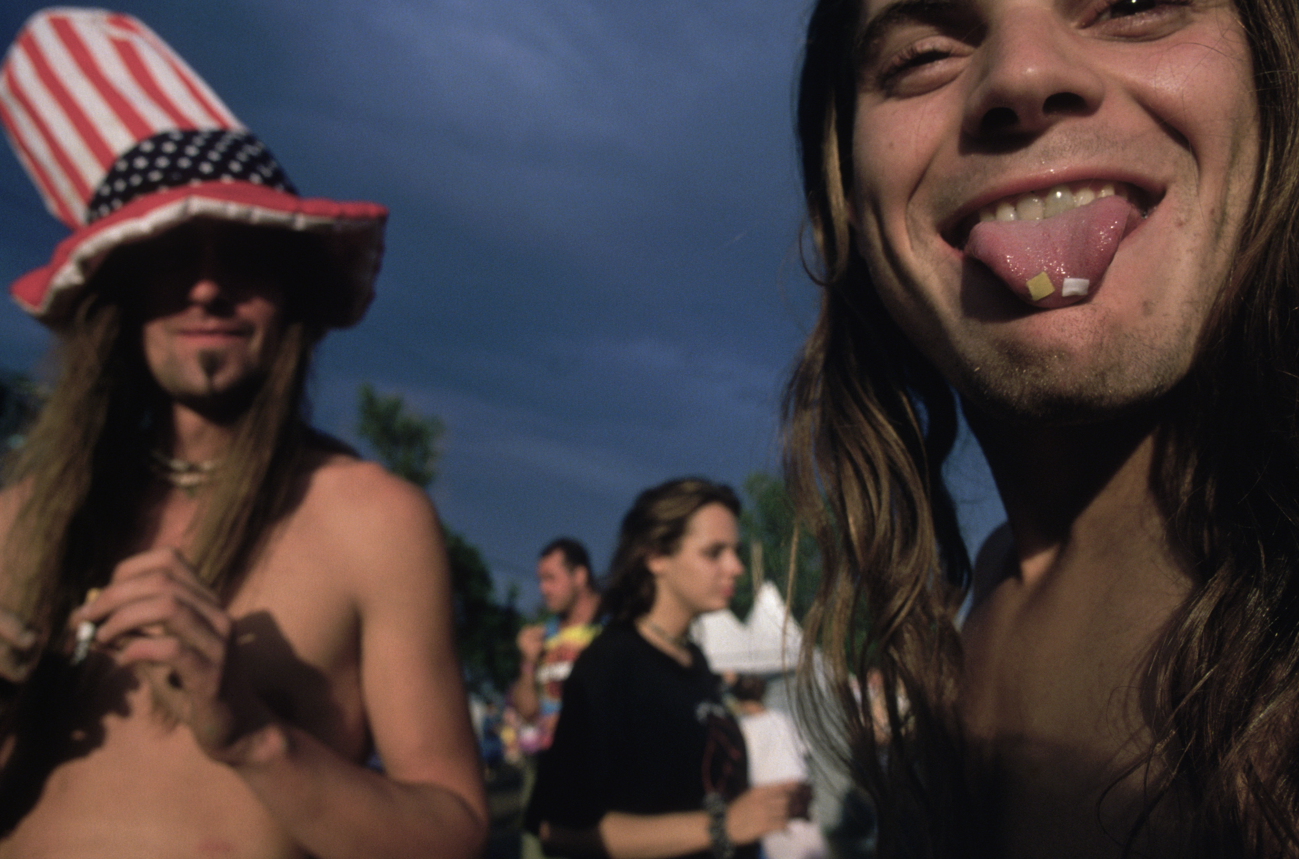 Saugerties, New York: Woodstock 94 - LSD tabs on tip of young man's tongue. (Photo by mark peterson/Corbis via Getty Images)