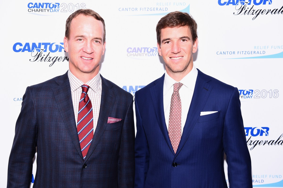 Former NFL player Peyton Manning and NY Giants, NFL player Eli Manning attend the Annual Charity Day hosted by Cantor Fitzgerald, BGC and GFI at Cantor Fitzgerald on September 12, 2016 in New York City.  (Photo by Dave Kotinsky/Getty Images for Cantor Fitzgerald)