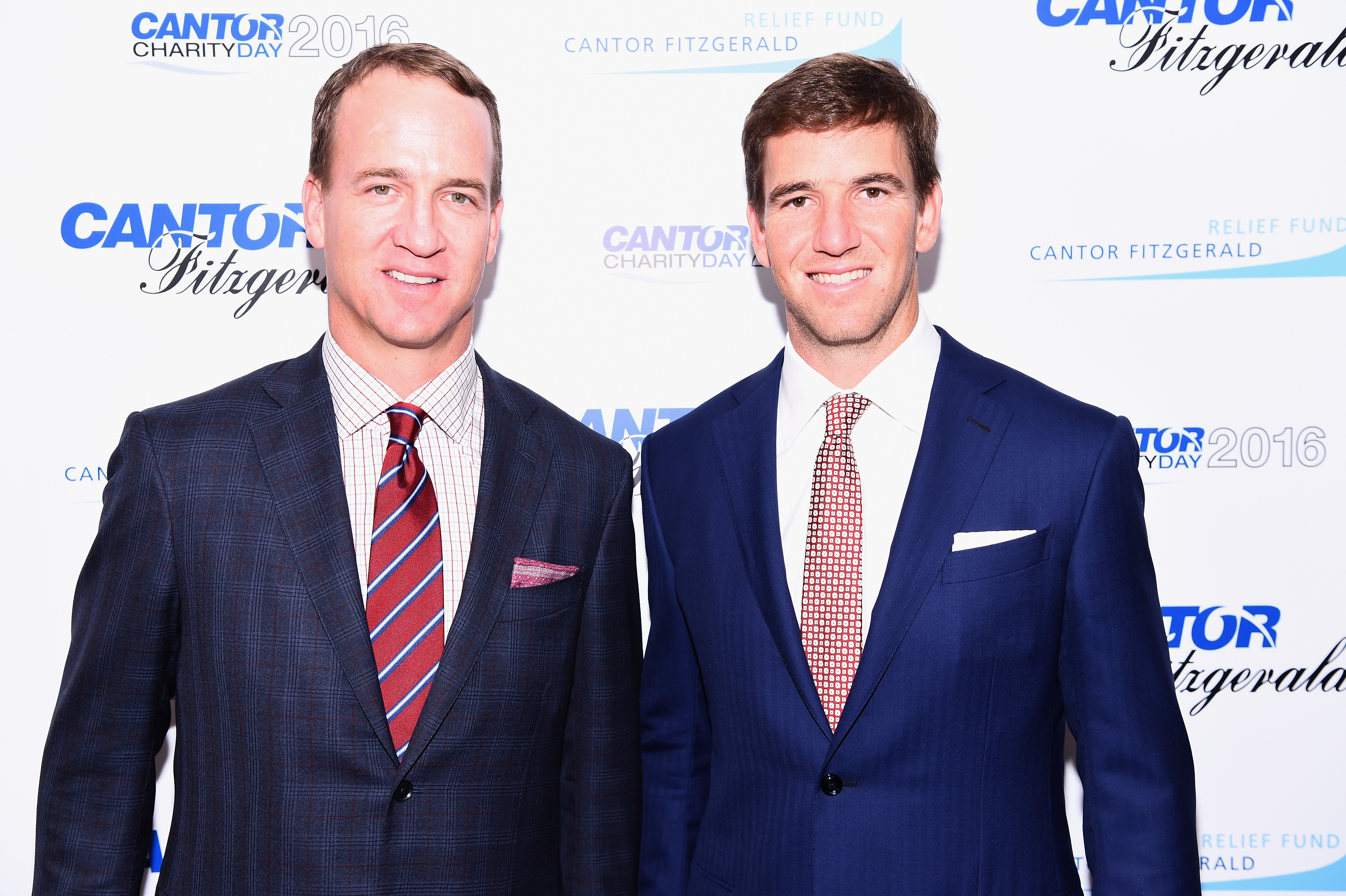 Former NFL player Peyton Manning and NY Giants, NFL player Eli Manning attend the Annual Charity Day hosted by Cantor Fitzgerald, BGC and GFI at Cantor Fitzgerald on September 12, 2016 in New York City. (Photo by Dave Kotinsky/Getty Images for Cantor Fitzgerald)