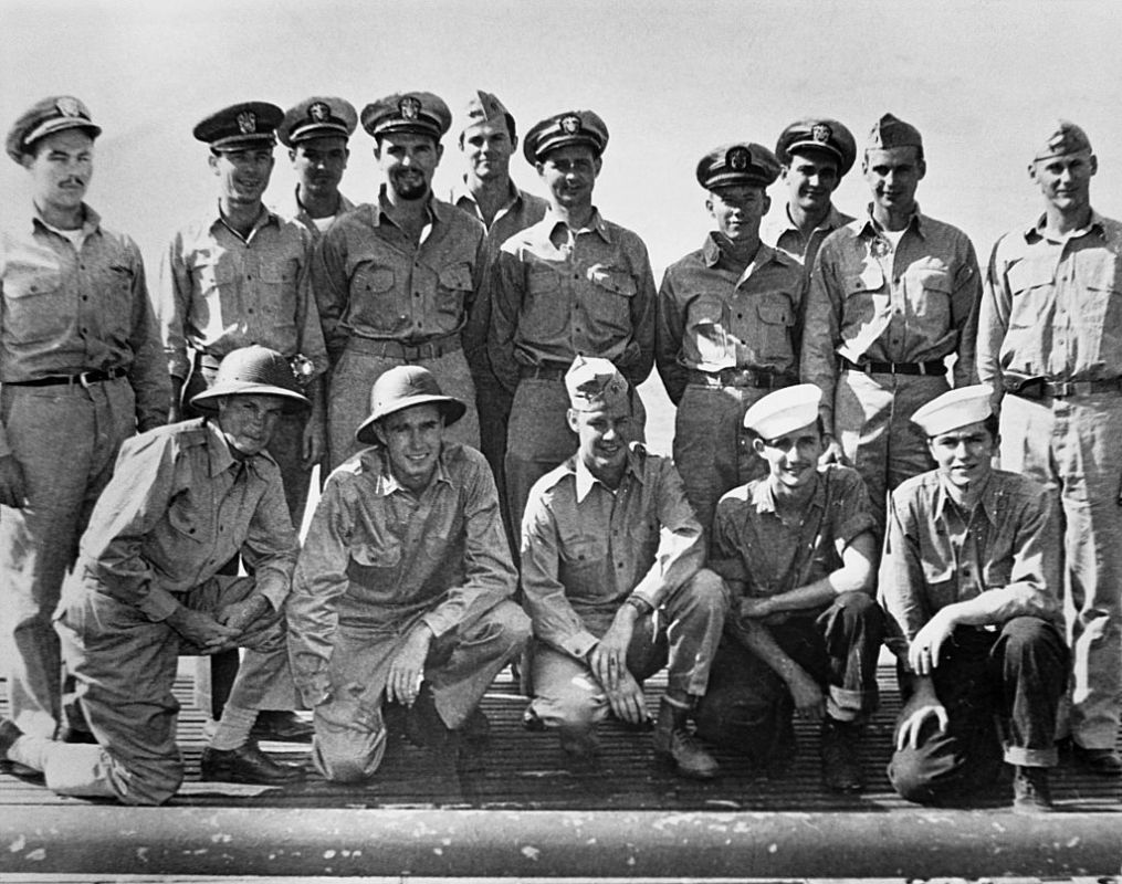 A portrait of the officers of the USS Finback and some U.S. Navy pilots and crew rescued by the Finback. Kneeling second from the left is Ensign George Bush, whose bomber was shot down by the Japanese near the Bonin Islands. September 1944. | Location: aboard the USS Finback, on the Pacific Ocean. (Photo by © CORBIS/Corbis via Getty Images)