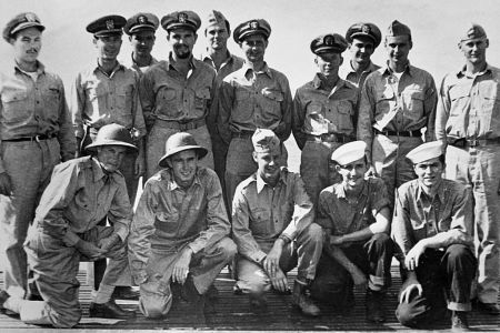 A portrait of the officers of the USS Finback and some U.S. Navy pilots and crew rescued by the Finback. Kneeling second from the left is Ensign George Bush, whose bomber was shot down by the Japanese near the Bonin Islands. September 1944. | Location: aboard the USS Finback, on the Pacific Ocean. (Photo by © CORBIS/Corbis via Getty Images)