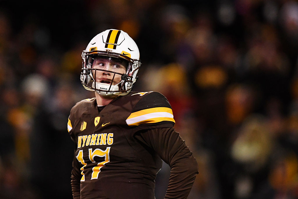 Josh Allen (17) of the Wyoming Cowboys reacts after forcing a fumble that resulted in a touchback on an interception by Damontae Kazee (23) of the San Diego State Aztecs during the first quarter of play on Saturday, December 3, 2016. (Photo by AAron Ontiveroz/The Denver Post via Getty Images)