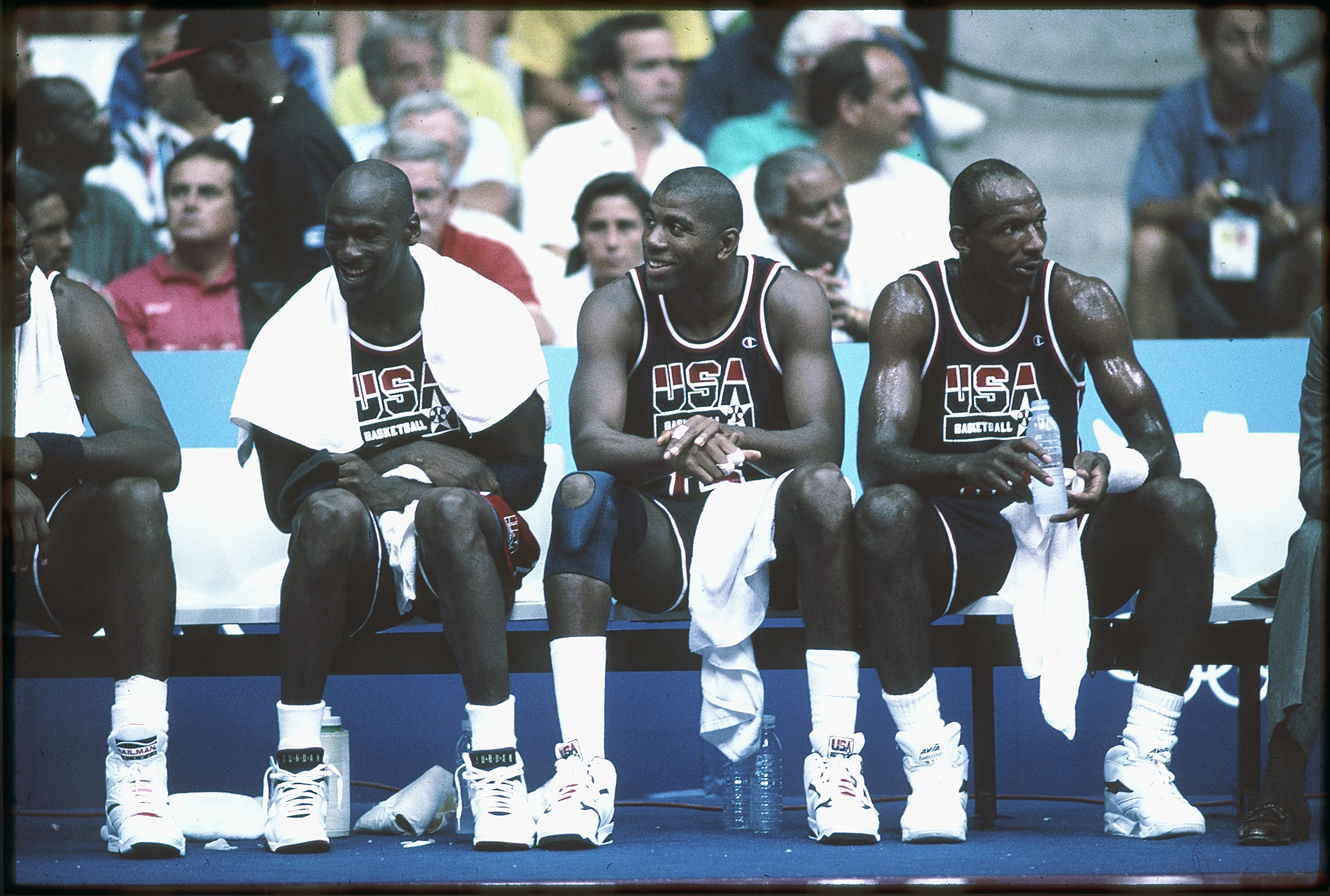 1992: Michael Jordan (L), Magic Johnson (M) and Clyde Drexler (R) of Team USA, the Dream Team, sit on the bench during the men's basketball competition at the 1992 Summer Olympics in Barcelona, Spain. (Photo by Icon Sportswire)