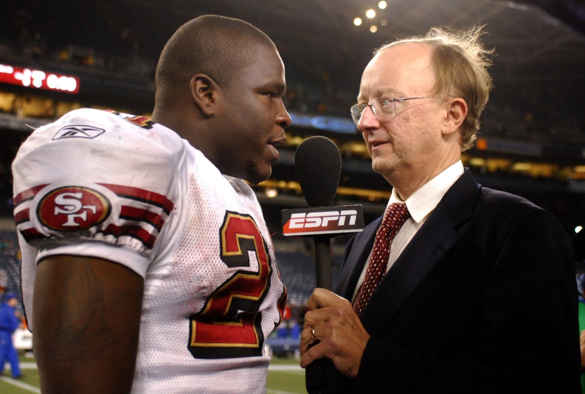 San Francisco 49ers running back Frank Gore is interviewed by John Clayton of ESPN after 24-14 victory over the Seattle Seahawks in NFL Network Thursday Night Football game at Qwest Field in Seattle, Wash. on December 14, 2006. (Photo by Kirby Lee/Getty Images)