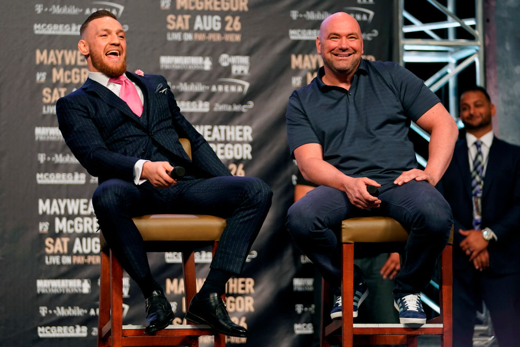 Conor McGregor and UFC President Dana White interact on stage during the Floyd Mayweather Jr. v Conor McGregor World Press Tour event at the Staples Center on July 11, 2017 in Los Angeles, California. (Photo by Jeff Bottari/Zuffa LLC/Zuffa LLC via Getty Images)