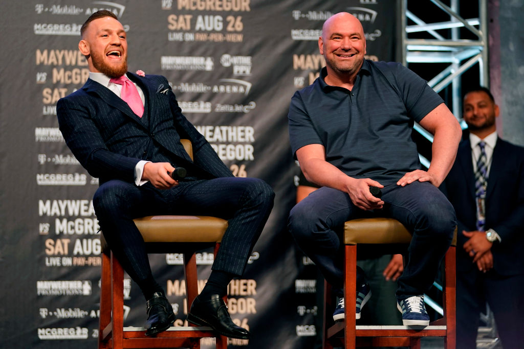 Conor McGregor and UFC President Dana White interact on stage during the Floyd Mayweather Jr. v Conor McGregor World Press Tour event at the Staples Center on July 11, 2017 in Los Angeles, California. (Photo by Jeff Bottari/Zuffa LLC/Zuffa LLC via Getty Images)
