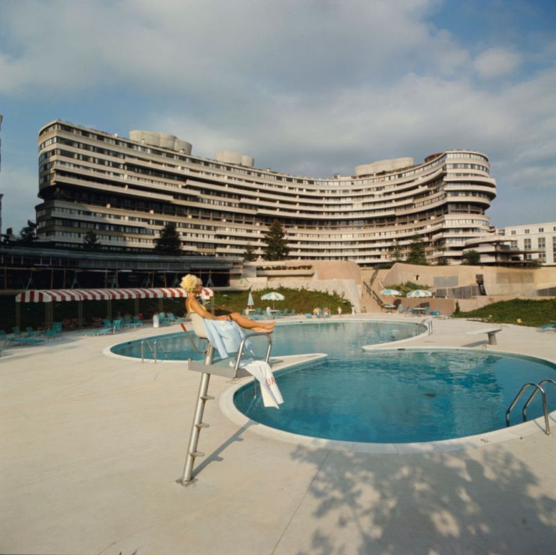 Lifeguard Linda Fox sits poolside at the Watergate complex, Washington DC, 1969. In the center rear is the Watergate East co-op apartment building. (Photo by Michael Rougier/The LIFE Picture Collection/Getty Images)