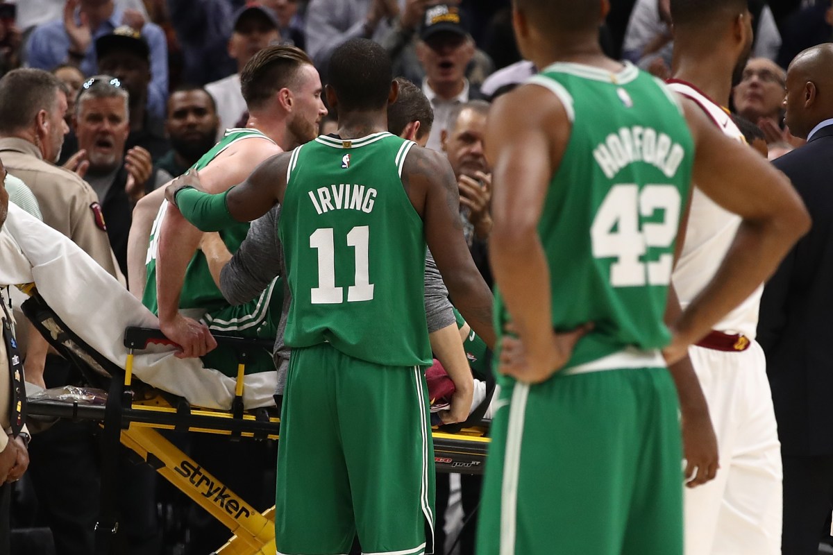 Kyrie Irving #11 of the Boston Celtics consoles Gordon Hayward #20 after Hayward was injured while playing the Cleveland Cavaliers at Quicken Loans Arena on October 17, 2017 in Cleveland, Ohio. (Gregory Shamus/Getty Images)