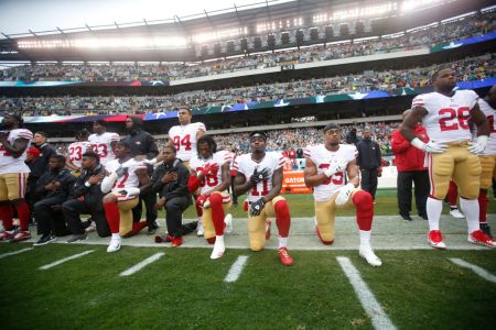Members of the San Francisco 49ers kneel during the anthem prior to the game against the Philadelphia Eagles at Lincoln Financial Field on October 29, 2017 in Philadelphia, Pennsylvania. (Photo by Michael Zagaris/San Francisco 49ers/Getty Images)  *** Local Caption ***