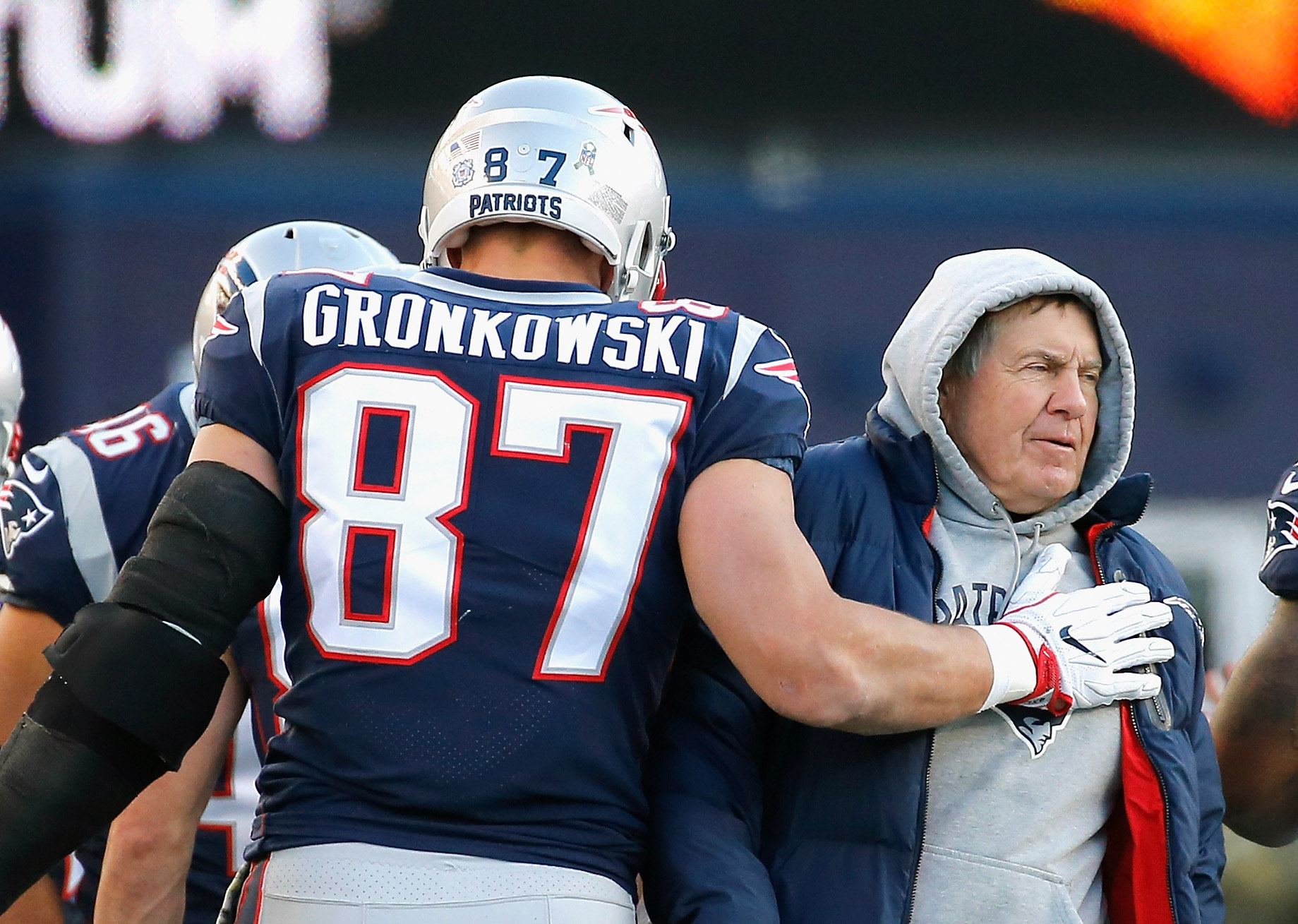 Rob Gronkowski #87 of the New England Patriots reacts with head coach Bill Belichick after catching a touchdown pass during the third quarter of a game against the Miami Dolphins at Gillette Stadium on November 26, 2017 in Foxboro, Massachusetts. (Photo by Jim Rogash/Getty Images)