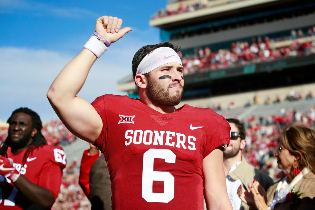 Quarterback Baker Mayfield #6 of the Oklahoma Sooners gestures to the crowd after Senior Day announcements before the game against the West Virginia Mountaineers at Gaylord Family Oklahoma Memorial Stadium on November 25, 2017 in Norman, Oklahoma. Oklahoma defeated West Virginia 59-31. (Photo by Brett Deering/Getty Images)