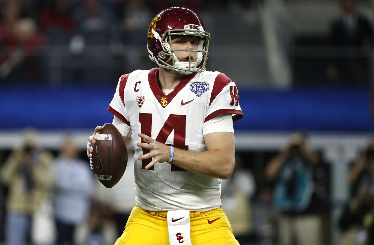Sam Darnold #14 of the USC Trojans looks to throw against the Ohio State Buckeyes in the first half of the 82nd Goodyear Cotton Bowl Classic between USC and Ohio State at AT&T Stadium on December 29, 2017 in Arlington, Texas. (Photo by Ron Jenkins/Getty Images)