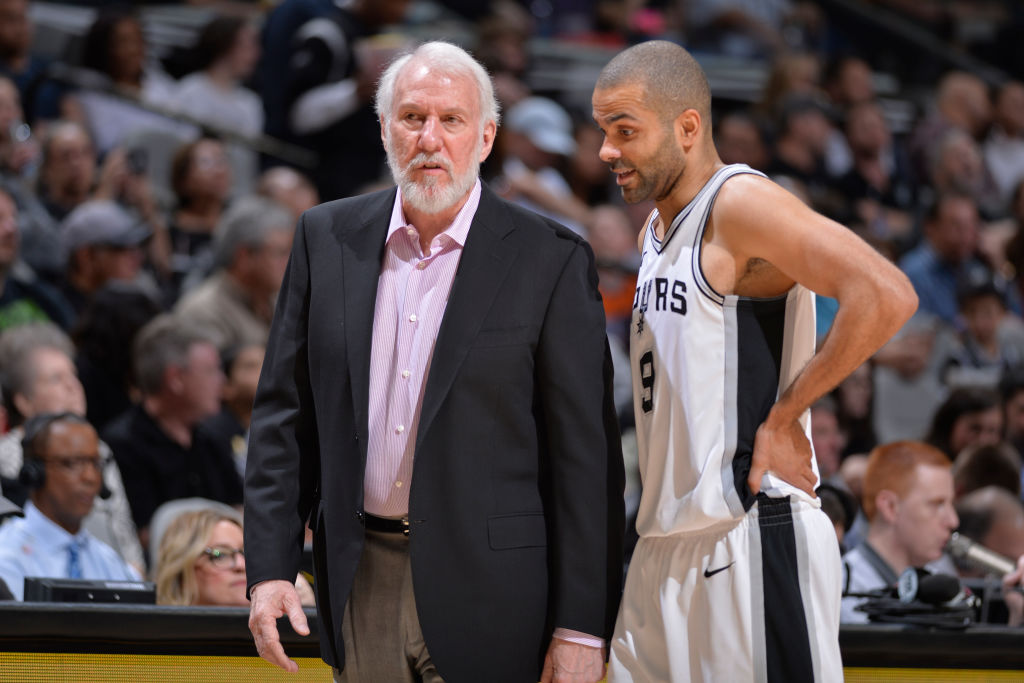 Head Coach Gregg Popovich of the San Antonio Spurs talks to Tony Parker #9 of the San Antonio Spurs during the game against the New Orleans Pelicans on March 15, 2018 at the AT&T Center in San Antonio, Texas. (Photos by Mark Sobhani/NBAE via Getty Images)